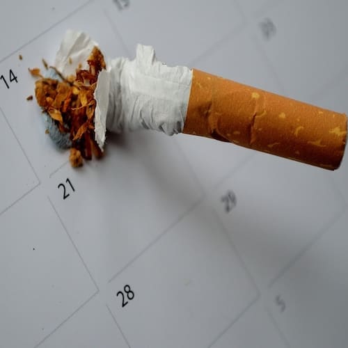 Addictions A cigarette crushed out on a calendar square when they stopped smoking