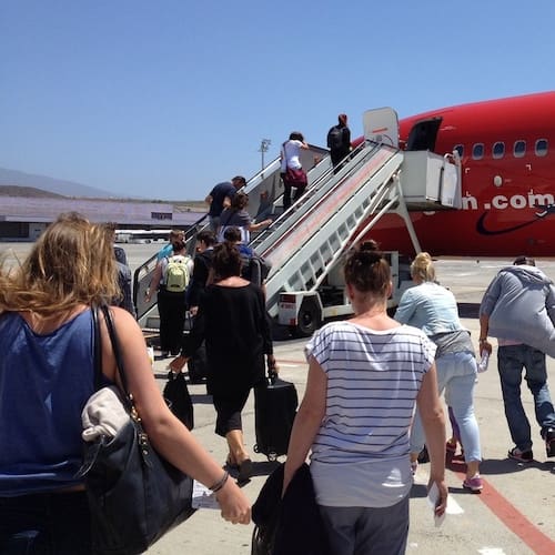 Flying Anxiety Hypnotherapy For Flying Anxiety - Anxiety free passengers boarding a plane on holiday