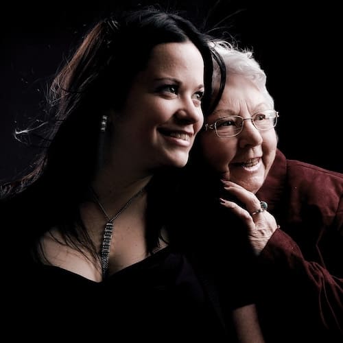 Grief-Loss-Flashbacks Reviews An adult woman smiling happily with her grandmother